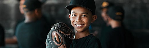 Young Boy Baseball Athlete Smiling at Camera Wearing Baseball Glove